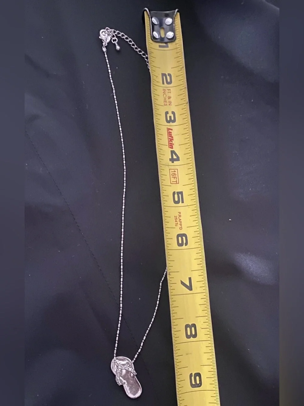 Coach pendant flip